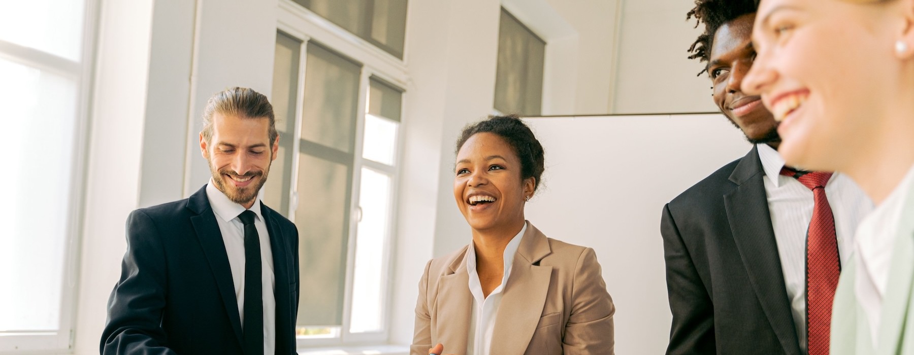 business dressed people laughing