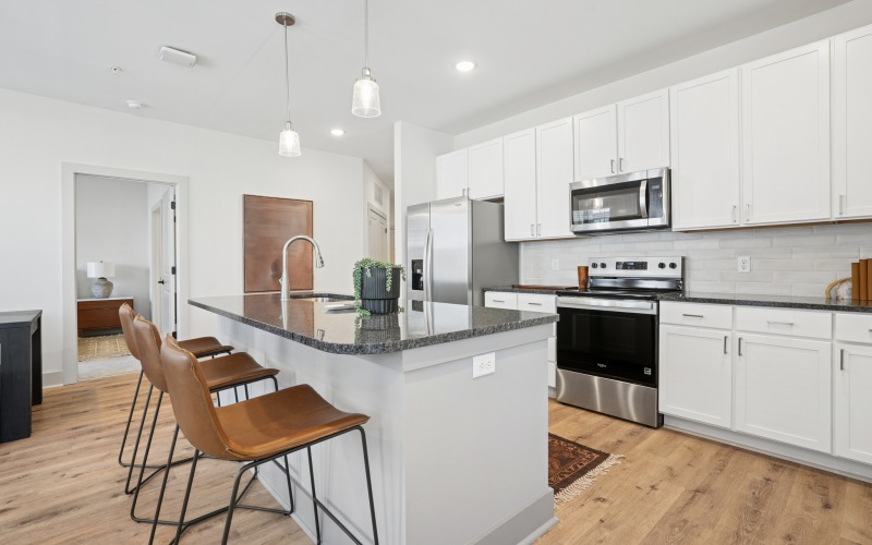a kitchen with white cabinets