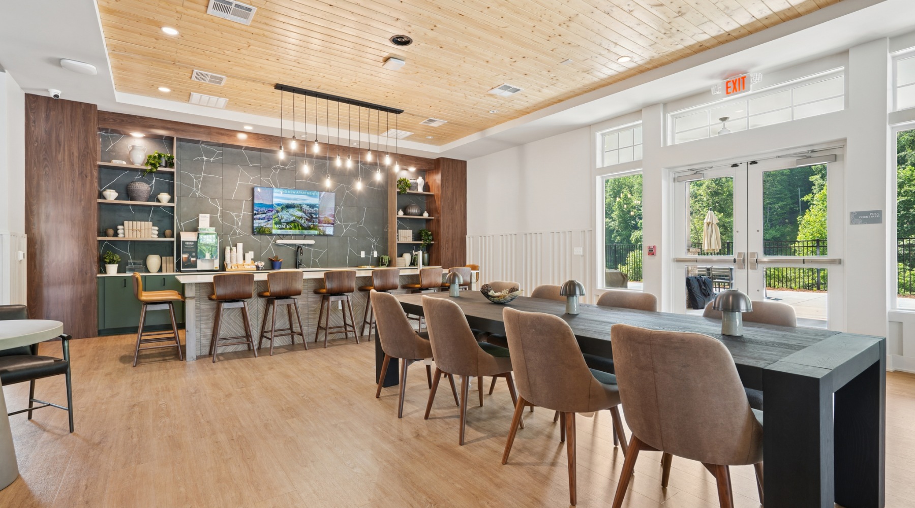 Clubroom Resident kitchen and dining area at The Hominy apartments in Candler, NC.