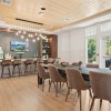 clubroom with TV and long table with seating